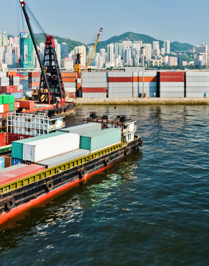 Boats loading shipping containers