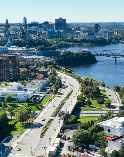 Aerial view of the Ottawa river, a street and downtown buildings. 