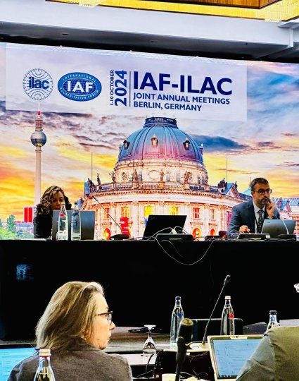 Abdel Kassou co-chairs a digital transformation working group at the IAF-ILAC Joint Annual Meetings in Berlin, Germany, with a backdrop of the Berlin skyline.