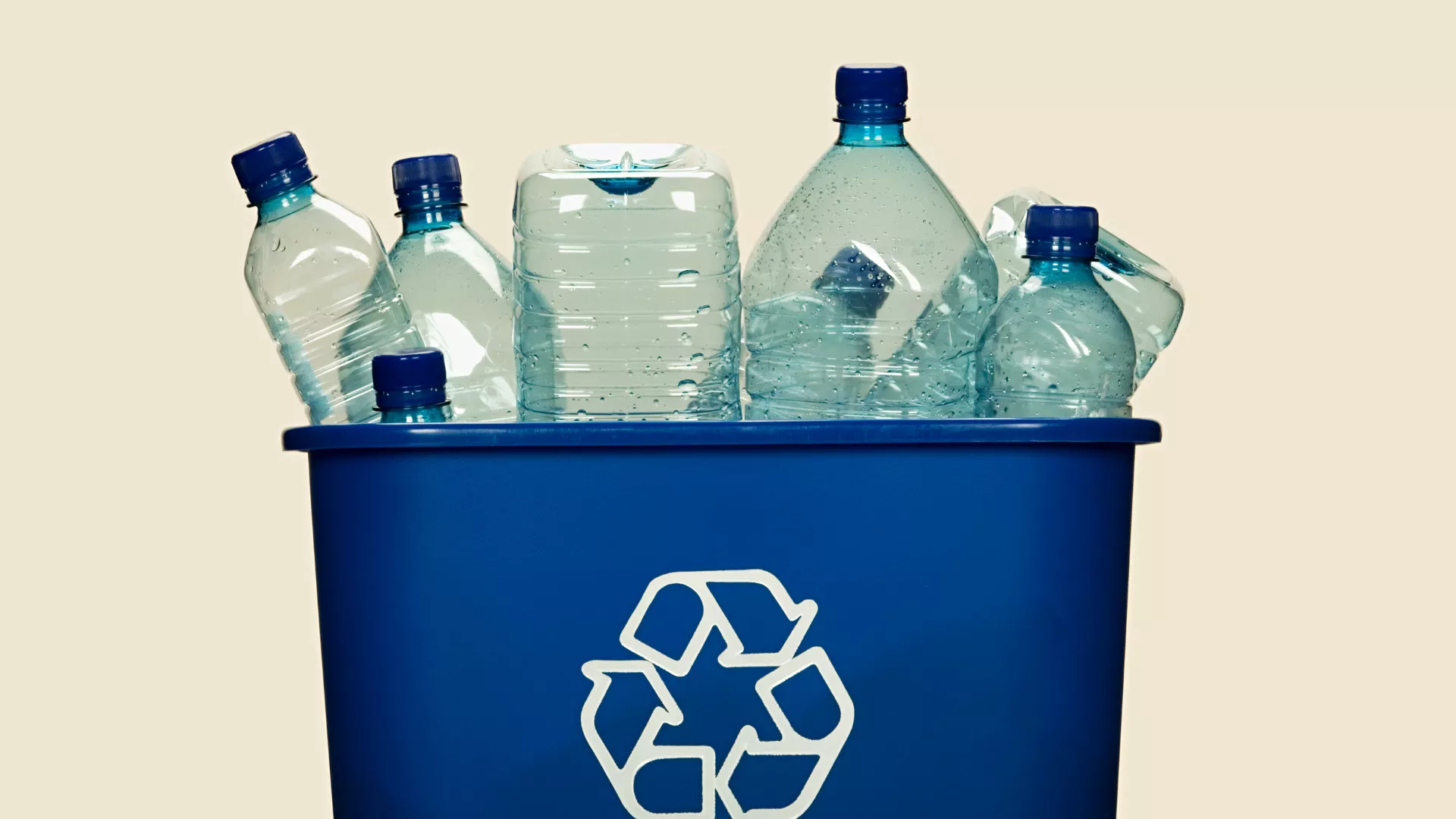 Plastic bottles in blue recycle bin